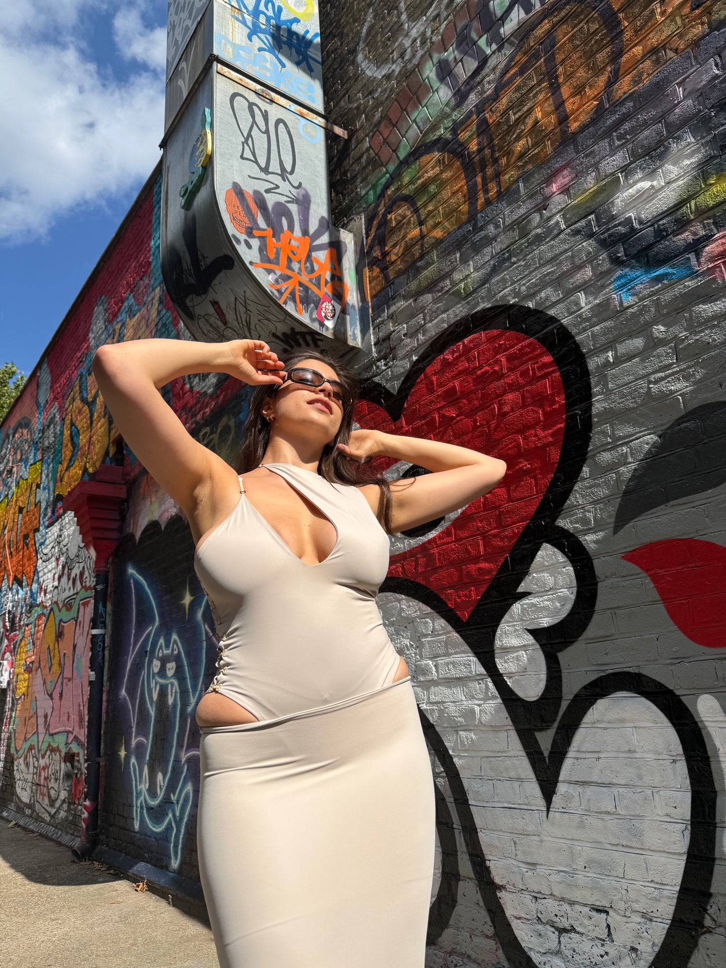 Beige Asp bodysuit in ECONYL® technical jersey, worn on model.