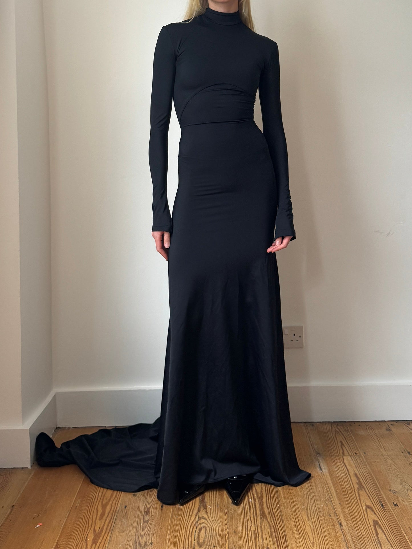Black Manta high-neck gown in ECONYL® technical jersey, worn on model.