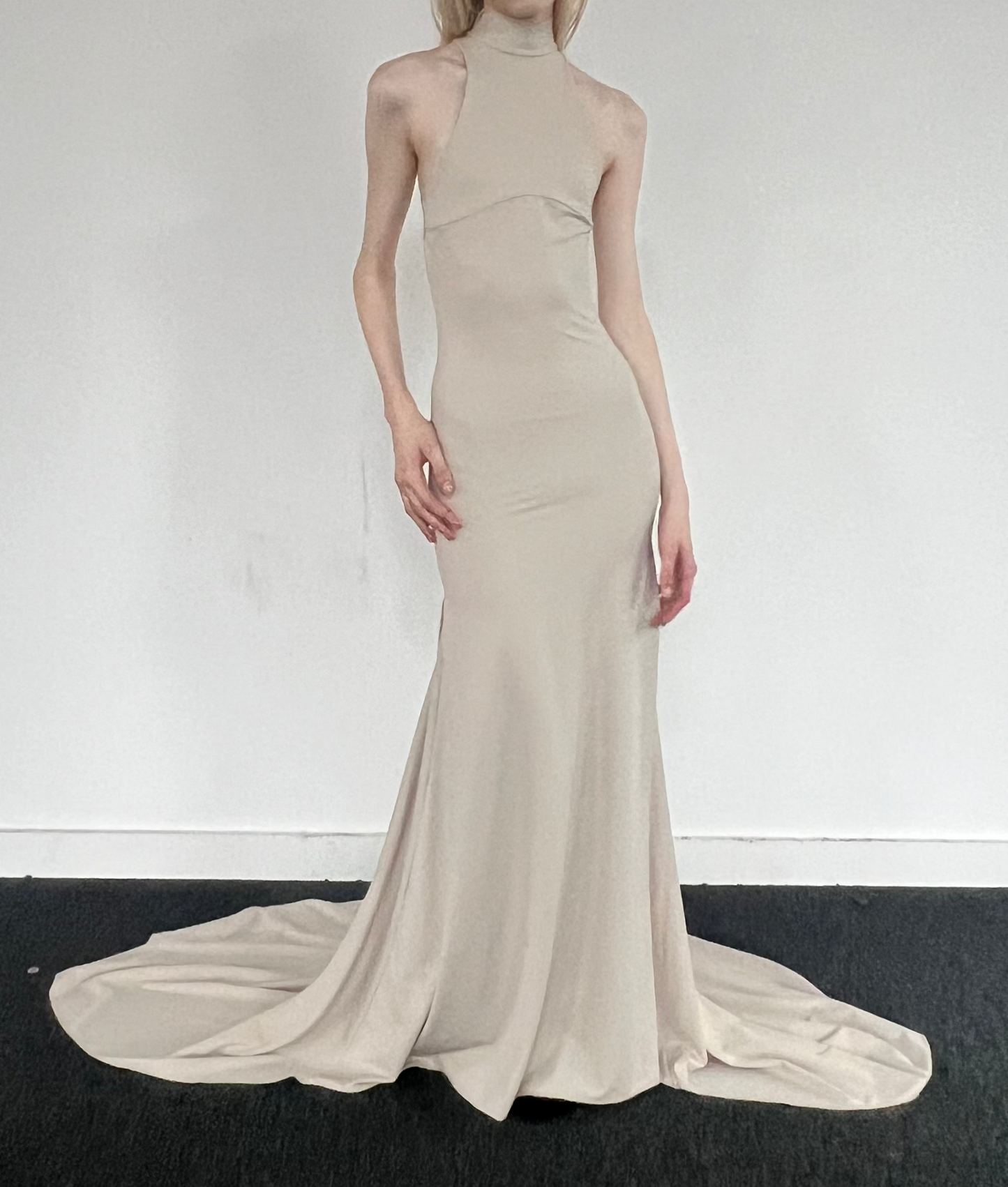 Beige Mirage halter gown in ECONYL® technical jersey, worn on model.