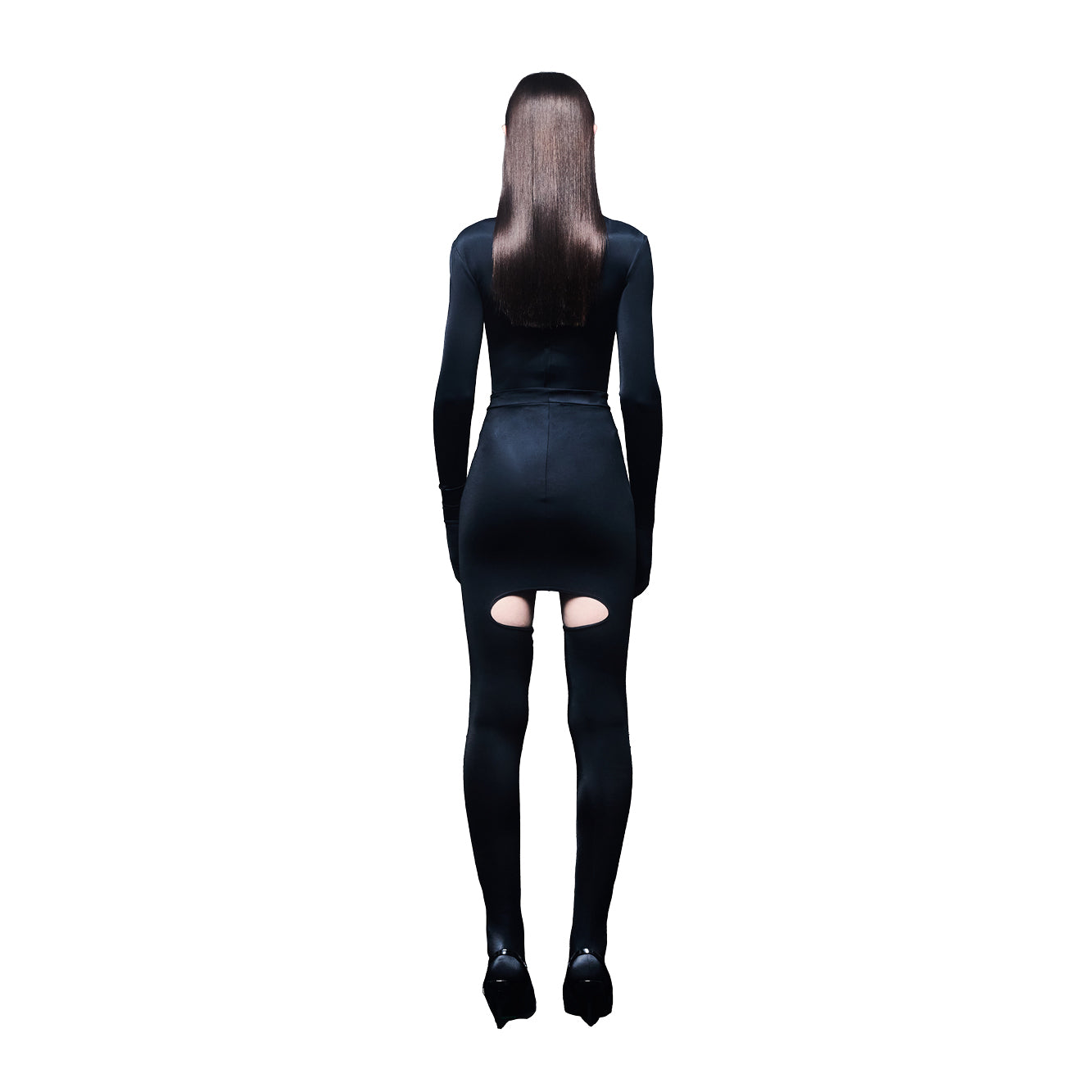 Person wearing a black outfit with cut-out design on a white background