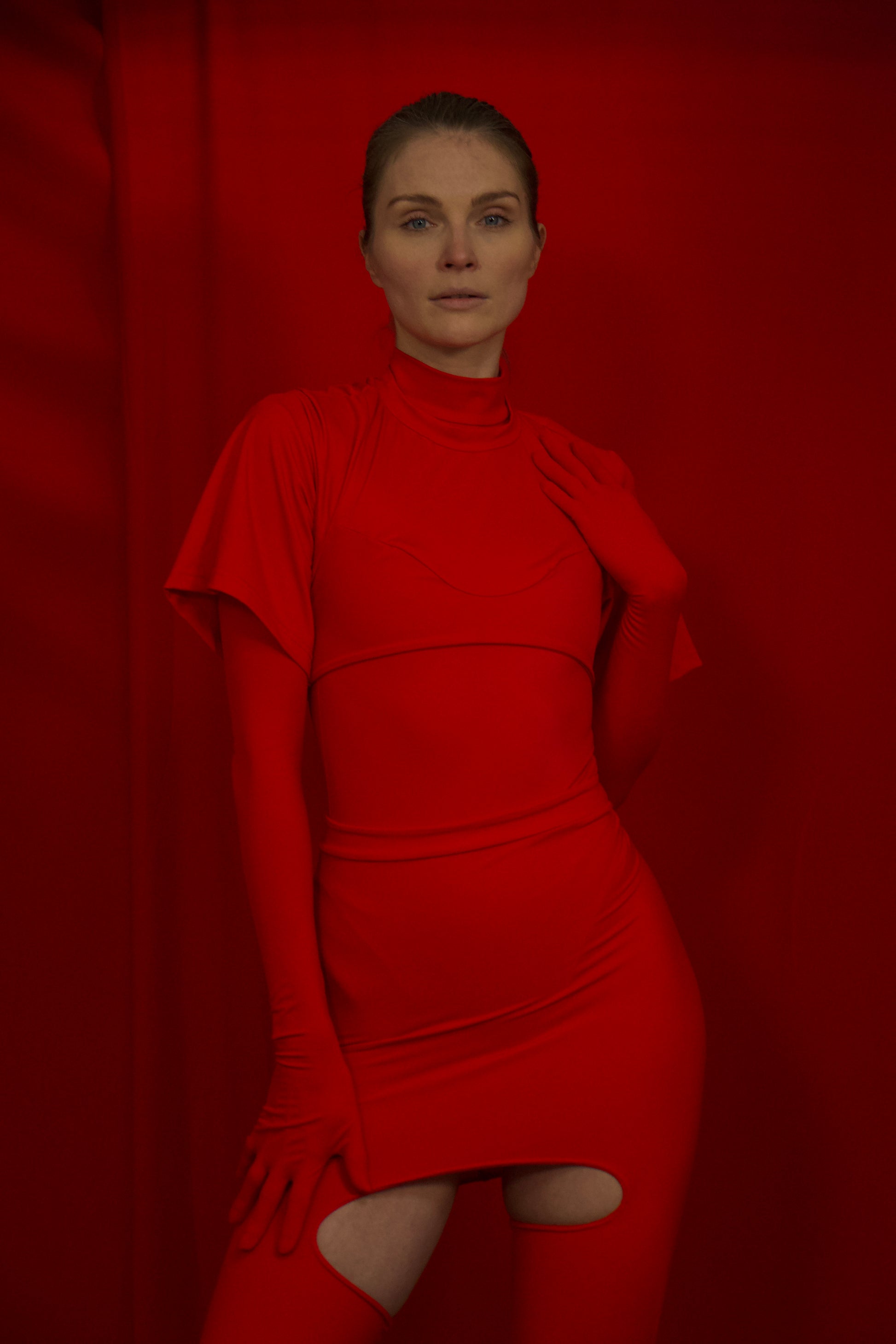 Red Medusa crop top in ECONYL® technical jersey, worn on model.