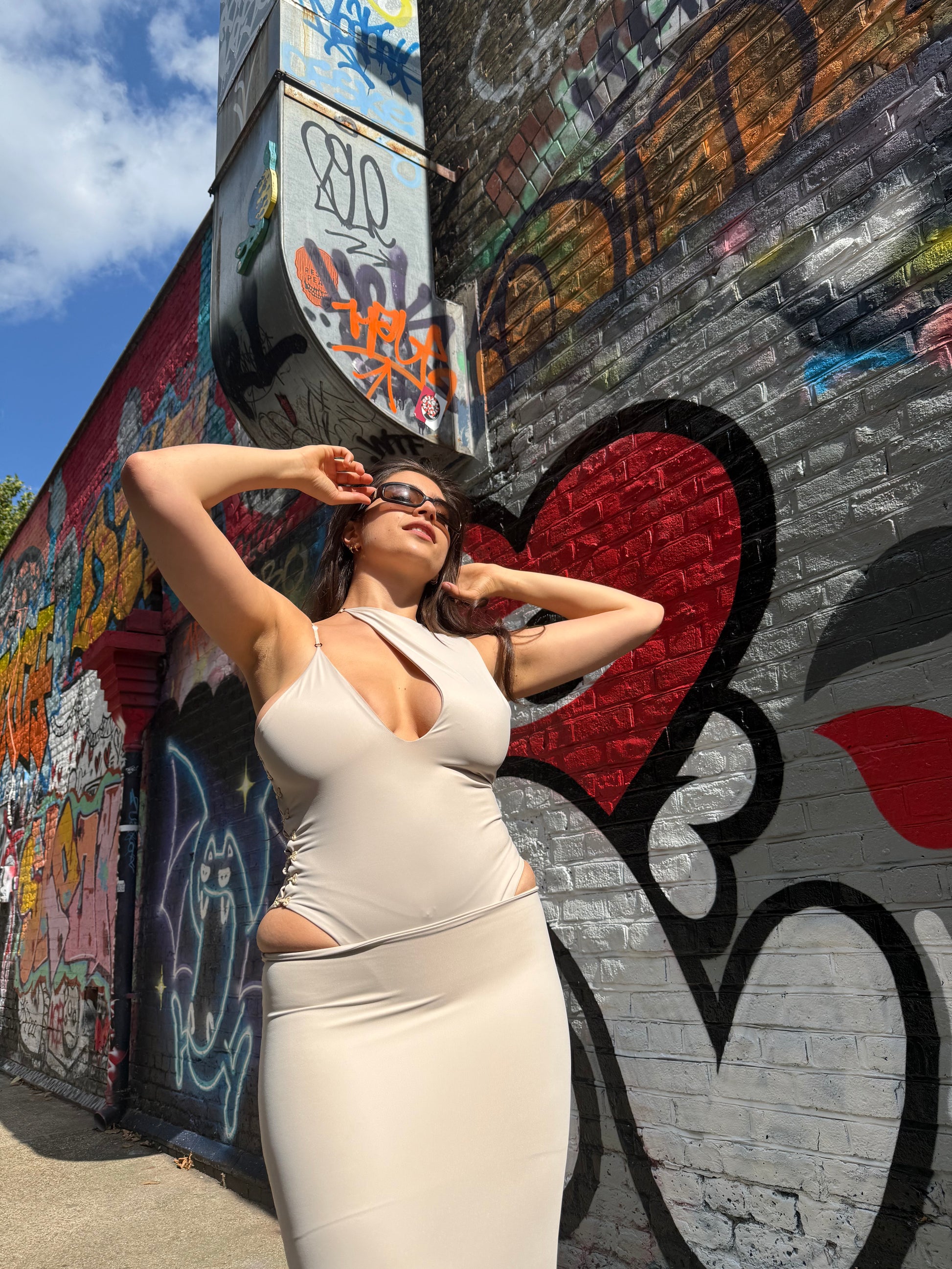 Beige Asp bodysuit in ECONYL® technical jersey, worn on model.