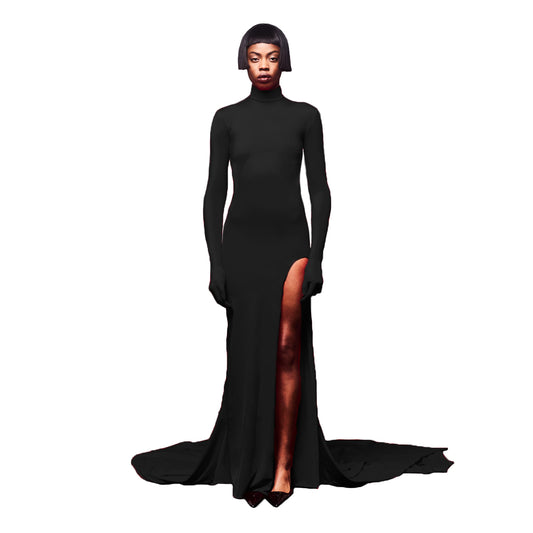 Woman wearing a black long-sleeve gown with a high slit on a white background